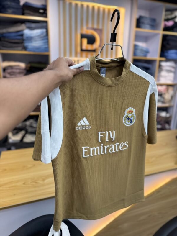Real Madrid 2024-25 third kit dark brown jersey. The official version is the "Real Madrid 24/25 Third Jersey"